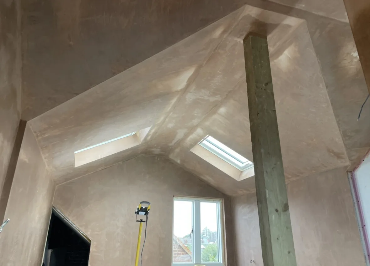 Vaulted loft ceiling plasterboarded ready for skim, with dual Velux skylights, by D.E.C Plastering
